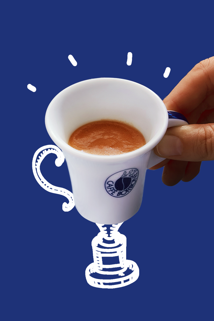 Hand holding a white cup with coffee on a blue background